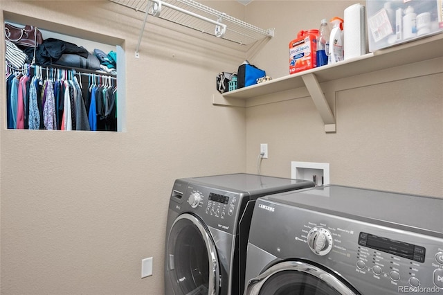 washroom with washing machine and dryer