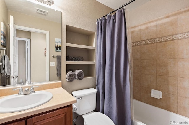 full bathroom with shower / tub combo with curtain, vanity, and toilet