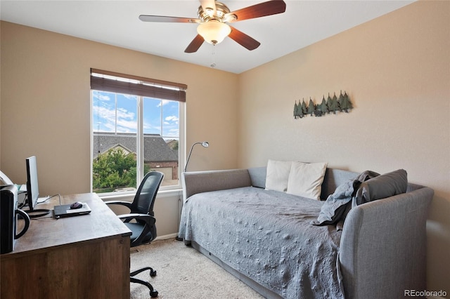 bedroom featuring light colored carpet and ceiling fan