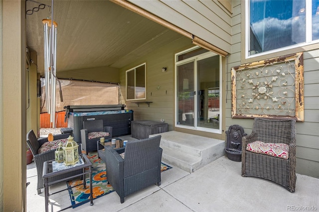 view of patio with a hot tub