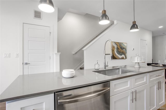 kitchen with visible vents, pendant lighting, a sink, white cabinetry, and dishwasher