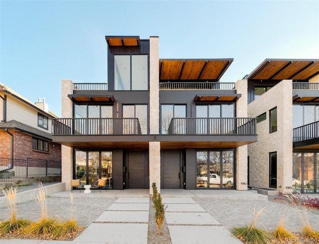 exterior space featuring a balcony and a garage