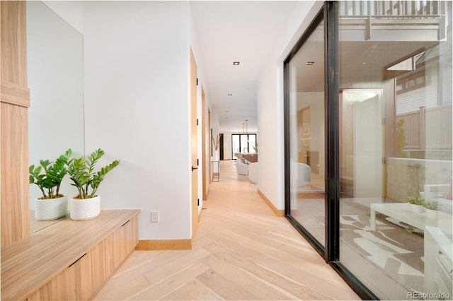 corridor featuring light parquet flooring