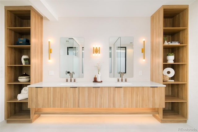 bathroom with built in shelves and vanity