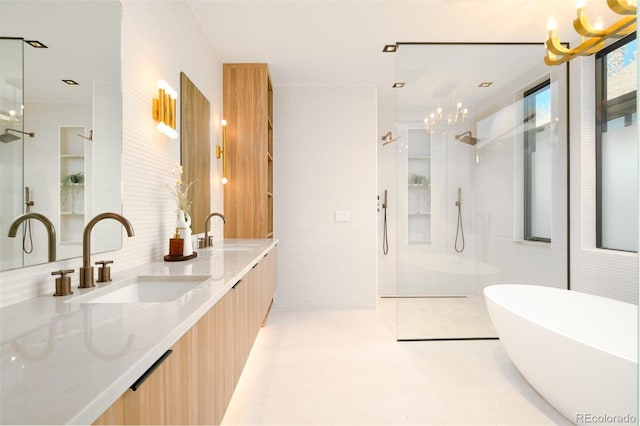 bathroom featuring vanity, shower with separate bathtub, an inviting chandelier, and tile walls