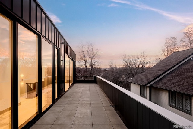 view of balcony at dusk