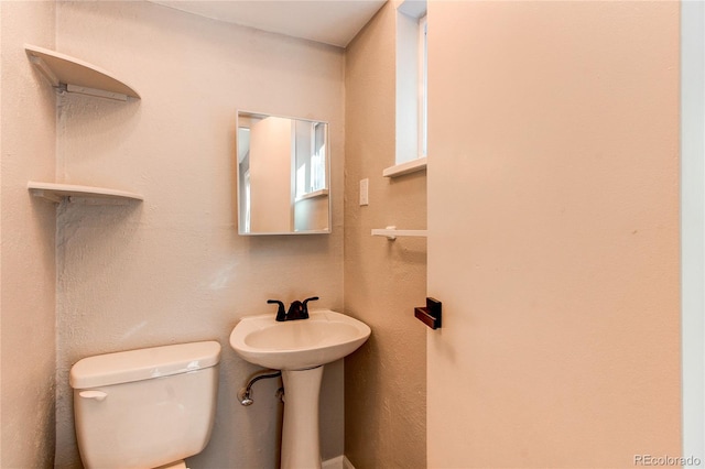 bathroom with sink and toilet