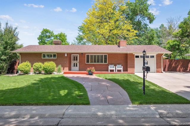 1040 Zang St, Golden, CO 80401 - single story home with brick siding, a garage, driveway, and a chimney