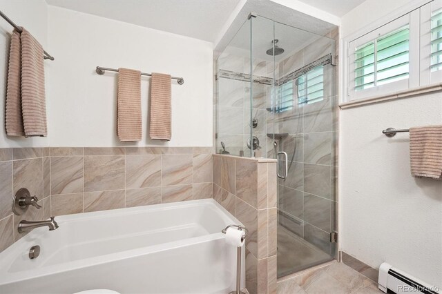 1040 Zang St, Golden, CO 80401 - bathroom featuring a baseboard heating unit, a bath, a stall shower, and tile patterned flooring