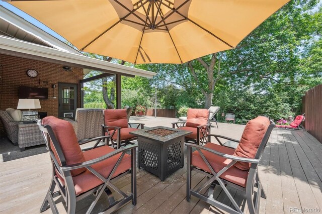 1040 Zang St, Golden, CO 80401 - wooden terrace with an outdoor living space with a fire pit