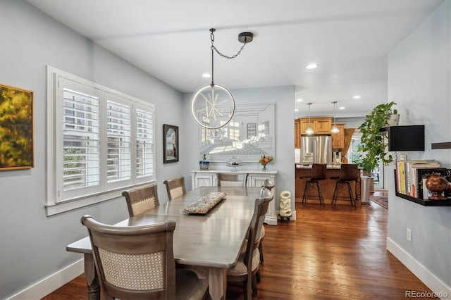 dining room featuring an inviting chandelier, baseboards, dark wood-style flooring, and recessed lighting