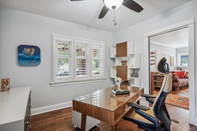 office space featuring ceiling fan, dark wood finished floors, visible vents, and baseboards