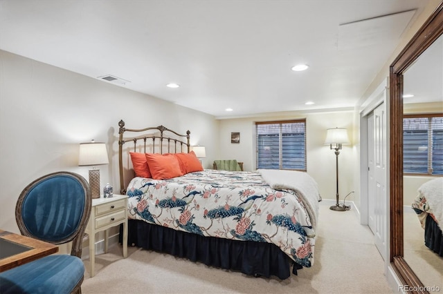 bedroom with recessed lighting, visible vents, and light colored carpet