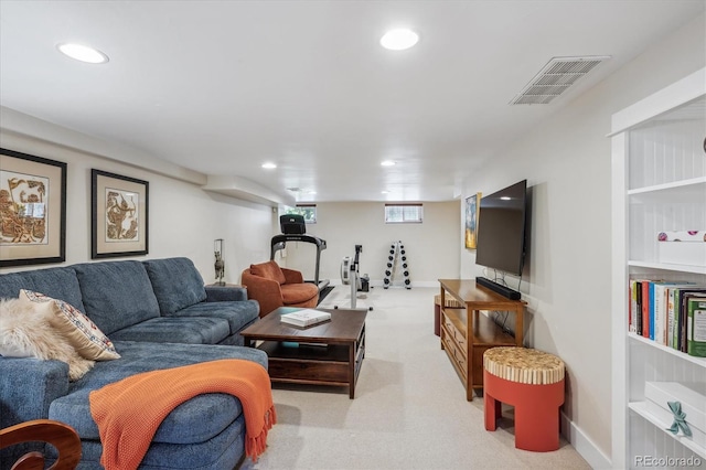 carpeted living area with baseboards, visible vents, and recessed lighting