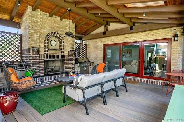 wooden deck featuring an outdoor living space with a fireplace, grilling area, and a ceiling fan