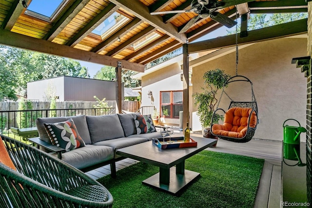 view of patio / terrace featuring ceiling fan, fence, and an outdoor hangout area