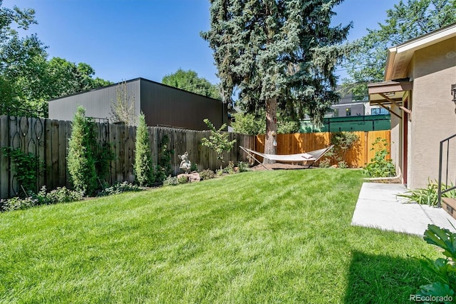 view of yard with a fenced backyard