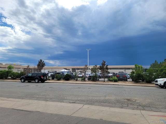 384 S Ironton St Unit 407, Aurora, CO 80012 - view of asphalt road with curbs and sidewalks