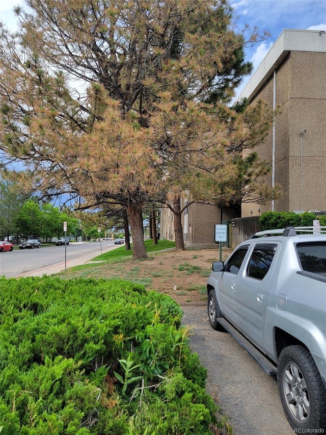 384 S Ironton St Unit 407, Aurora, CO 80012 - view of asphalt street with traffic signs