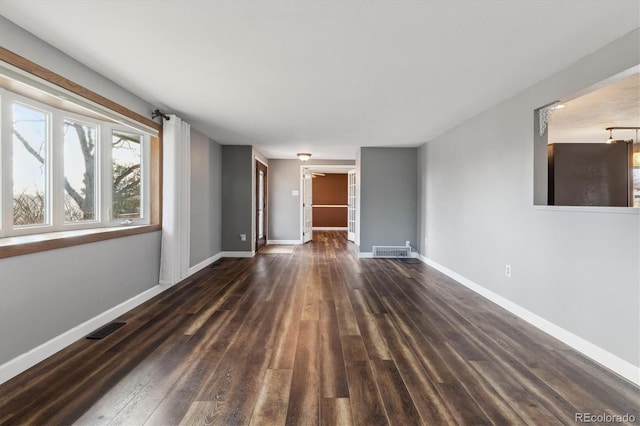 empty room featuring dark hardwood / wood-style flooring