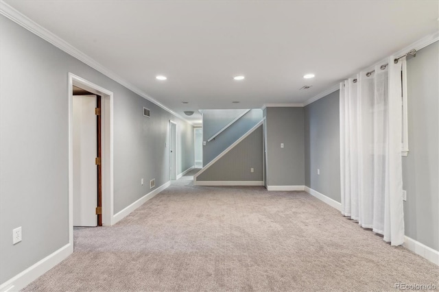 interior space with light colored carpet and ornamental molding