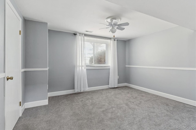 empty room featuring carpet and ceiling fan