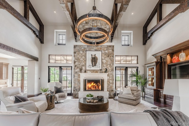 1820 Mallard Dr, Broomfield, CO 80020 - living area featuring high vaulted ceiling, a stone fireplace, and plenty of natural light