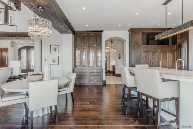 1820 Mallard Dr, Broomfield, CO 80020 - dining area with dark wood-style flooring, arched walkways, and recessed lighting