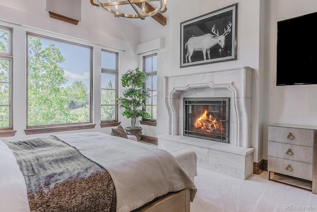 1820 Mallard Dr, Broomfield, CO 80020 - bedroom with multiple windows, a premium fireplace, and a chandelier