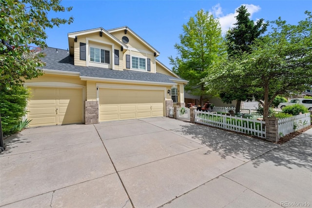 7638 S Hudson Way, Centennial, CO 80122 - view of front of house with driveway, a garage, and a shingled roof