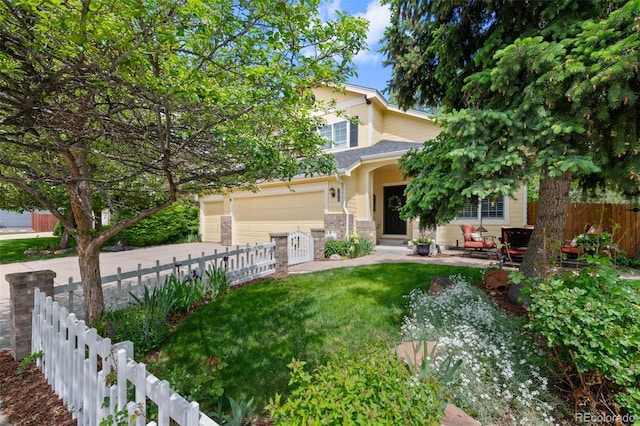 7638 S Hudson Way, Centennial, CO 80122 - view of property hidden behind natural elements with driveway, stone siding, and an attached garage