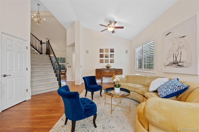 7638 S Hudson Way, Centennial, CO 80122 - living area with stairway, wood finished floors, a ceiling fan, baseboards, and a chandelier