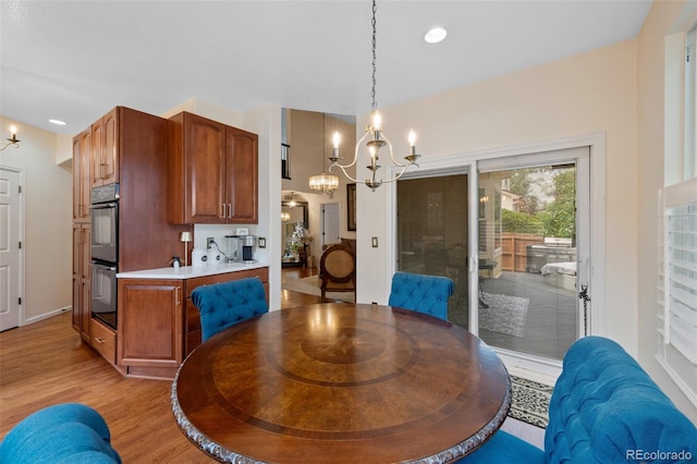 7638 S Hudson Way, Centennial, CO 80122 - dining room with a chandelier, light wood-style flooring, and recessed lighting