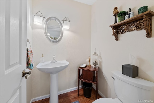 7638 S Hudson Way, Centennial, CO 80122 - half bathroom with toilet and wood finished floors