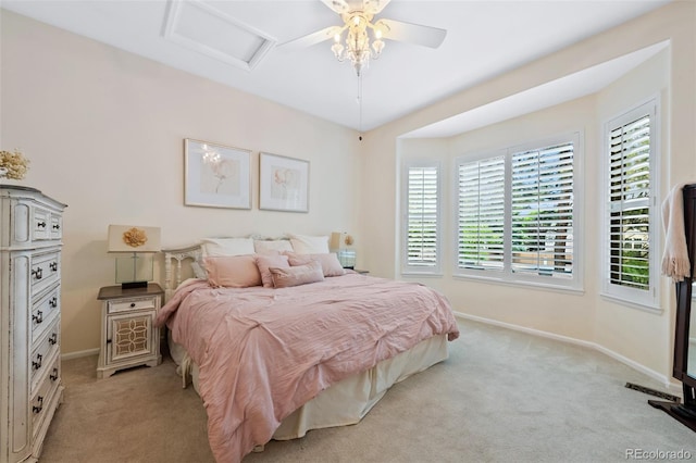 7638 S Hudson Way, Centennial, CO 80122 - bedroom with light carpet, baseboards, attic access, and a ceiling fan