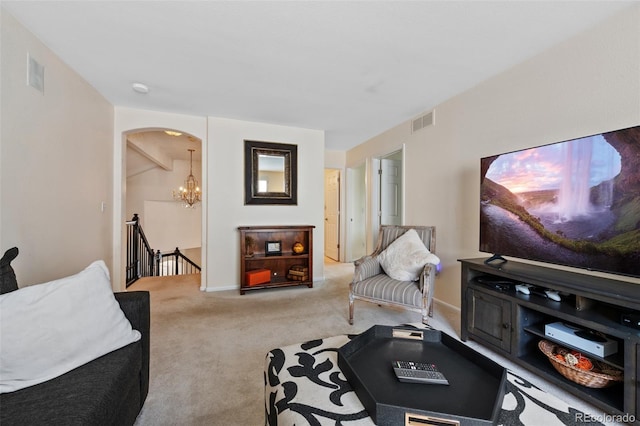 7638 S Hudson Way, Centennial, CO 80122 - living room with carpet floors, arched walkways, a chandelier, and baseboards