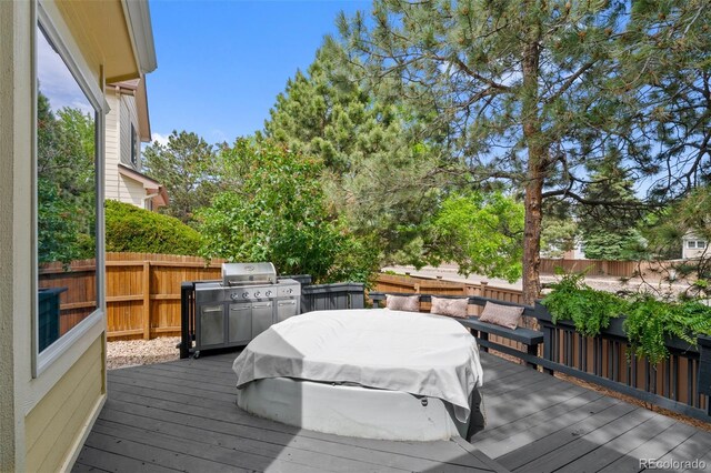7638 S Hudson Way, Centennial, CO 80122 - wooden terrace with a fenced backyard