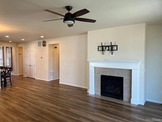 22822 E Union Cir, Aurora, CO 80015 - living area featuring recessed lighting, dark wood-style flooring, baseboards, a ceiling fan, and a tiled fireplace
