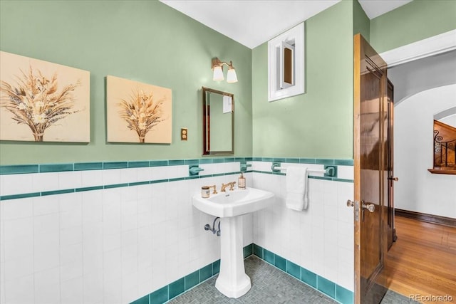 bathroom with tile walls and wainscoting