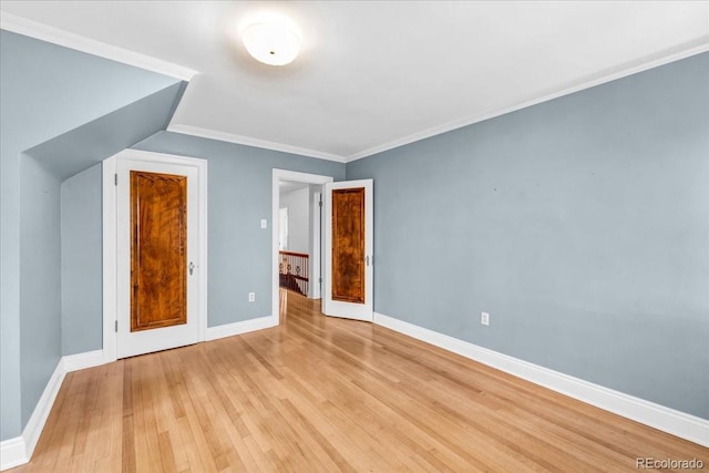 bonus room featuring baseboards and light wood-style flooring