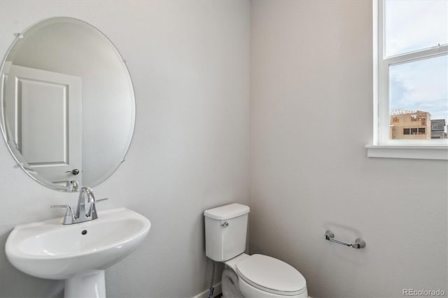 14131 Deertrack Ln, Parker, CO 80134 - half bath featuring a sink, toilet, and baseboards