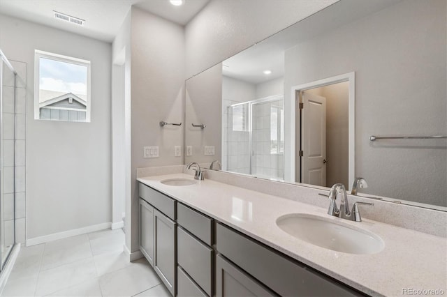 14131 Deertrack Ln, Parker, CO 80134 - full bath featuring a stall shower, double vanity, tile patterned flooring, and baseboards