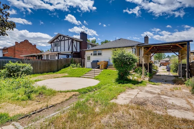 back of property featuring a patio