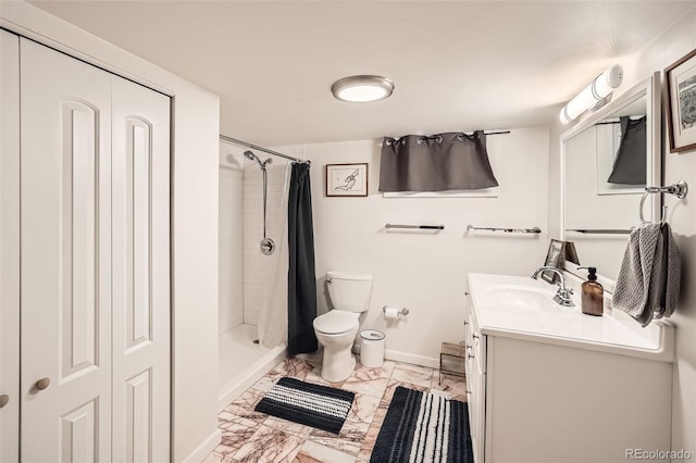 bathroom featuring vanity, curtained shower, and toilet