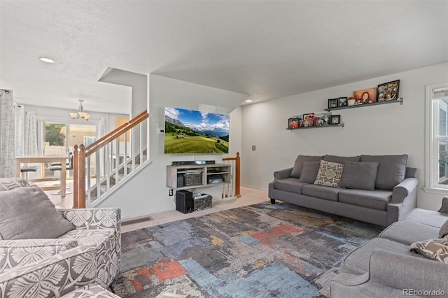 9272 E 108th Ave, Commerce City, CO 80640 - living area featuring a chandelier, carpet flooring, and stairway