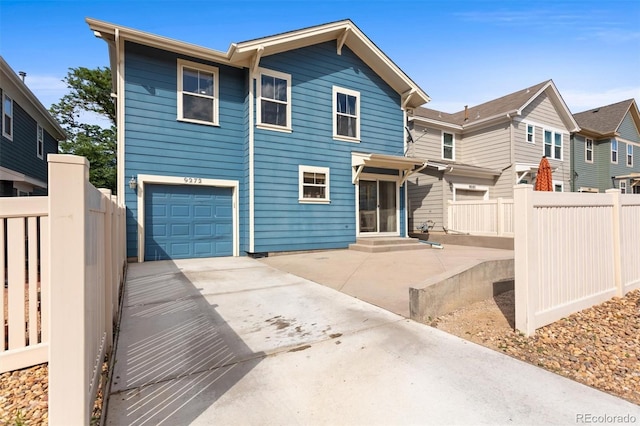 9272 E 108th Ave, Commerce City, CO 80640 - view of front facade with concrete driveway and an attached garage