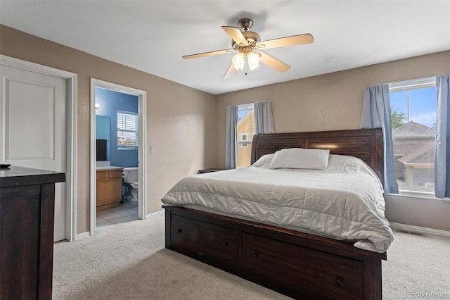 9272 E 108th Ave, Commerce City, CO 80640 - bedroom featuring light carpet, ensuite bath, and a ceiling fan