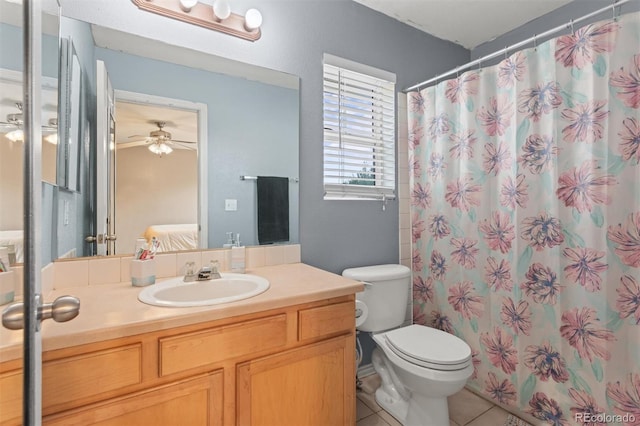 9272 E 108th Ave, Commerce City, CO 80640 - bathroom with vanity, tile patterned floors, connected bathroom, a ceiling fan, and a shower with shower curtain