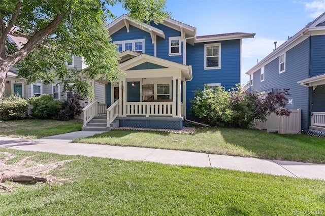 9272 E 108th Ave, Commerce City, CO 80640 - view of front of property with covered porch and a front lawn