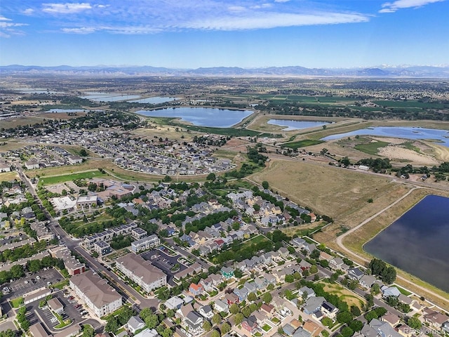 9272 E 108th Ave, Commerce City, CO 80640 - aerial overview of property's location featuring a water and mountain view and nearby suburban area